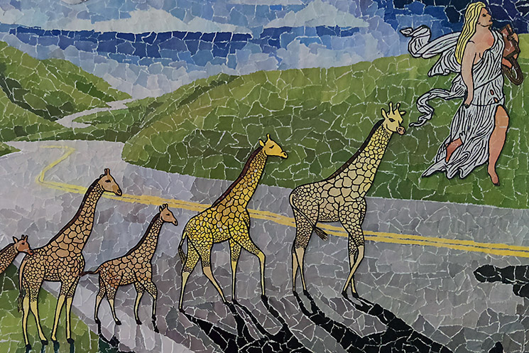 Angel Leading Giraffes Over A Road